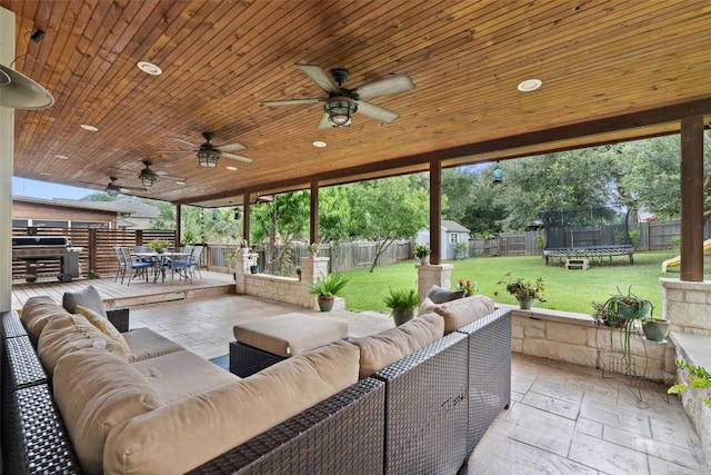 2705 Rosemount Cv, Round Rock, TX 78665 - view of patio featuring outdoor dining area, a trampoline, an outdoor living space, grilling area, and a ceiling fan