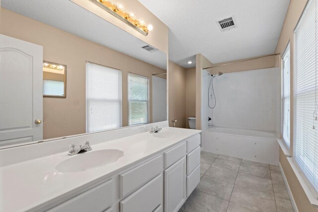 2507 Byfield Dr, Cedar Park, TX 78613 - full bath featuring shower / washtub combination, double vanity, toilet, and tile patterned flooring