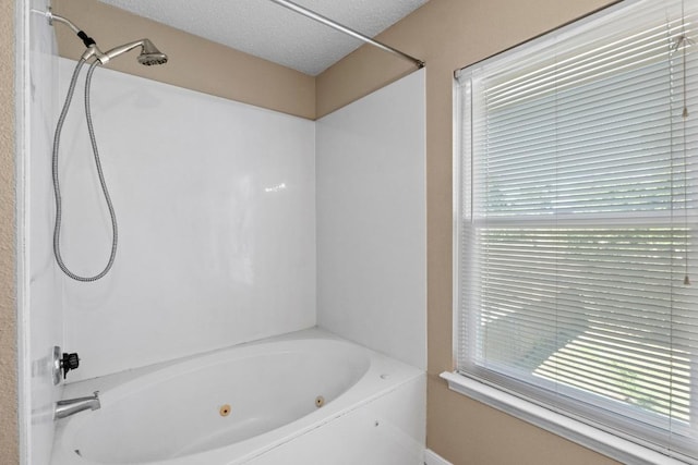 2507 Byfield Dr, Cedar Park, TX 78613 - bathroom featuring a combined bath / shower with jetted tub and a textured ceiling