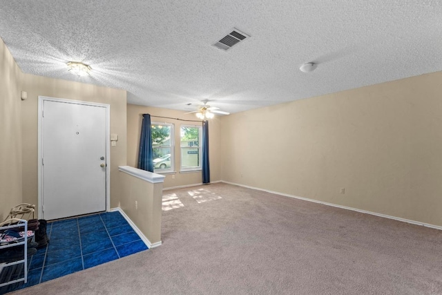 2507 Byfield Dr, Cedar Park, TX 78613 - entryway featuring ceiling fan, carpet floors, and a textured ceiling