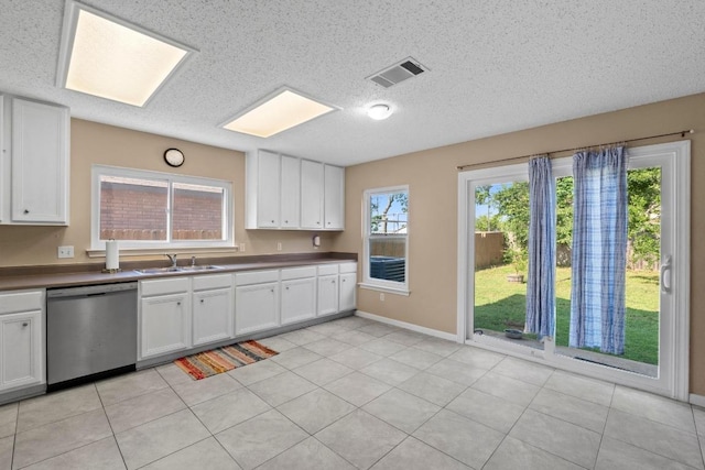 2507 Byfield Dr, Cedar Park, TX 78613 - kitchen featuring dishwasher, white cabinetry, a textured ceiling, and dark countertops
