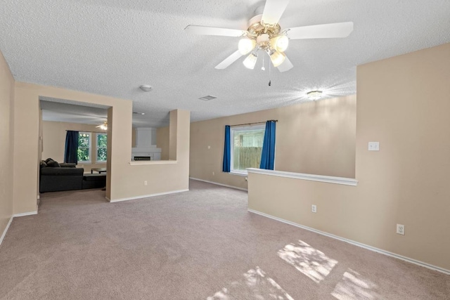 2507 Byfield Dr, Cedar Park, TX 78613 - unfurnished living room with ceiling fan, a textured ceiling, and carpet flooring