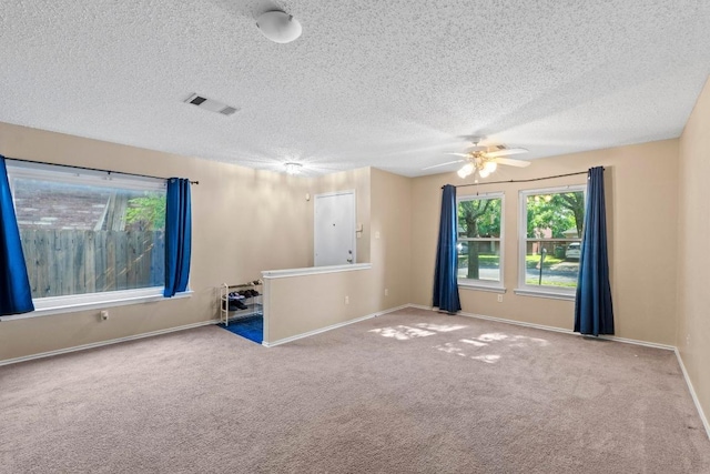 2507 Byfield Dr, Cedar Park, TX 78613 - carpeted spare room with a ceiling fan, a textured ceiling, and baseboards