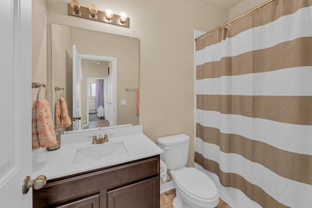 409 Red Matador Ln, Leander, TX 78641 - bathroom with toilet, vanity, and a shower with shower curtain