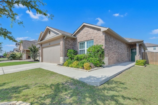 409 Red Matador Ln, Leander, TX 78641 - view of front of house with brick siding, concrete driveway, and a garage