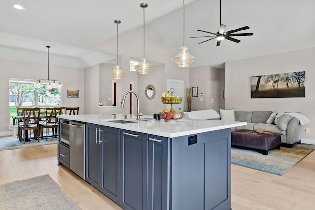208 E Nakoma, Round Rock, TX 78664 - kitchen featuring a sink, open floor plan, light wood-style flooring, lofted ceiling, and ceiling fan