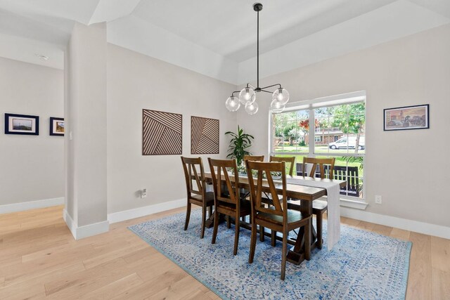 208 E Nakoma, Round Rock, TX 78664 - dining space with baseboards, light wood finished floors, and a chandelier