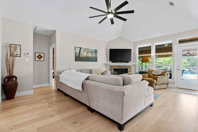 208 E Nakoma, Round Rock, TX 78664 - living room with a ceiling fan, a fireplace, light wood-type flooring, high vaulted ceiling, and baseboards