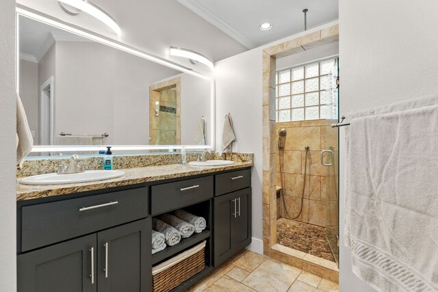 208 E Nakoma, Round Rock, TX 78664 - full bathroom featuring ornamental molding, a stall shower, double vanity, and tile patterned floors