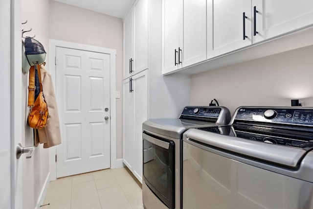 208 E Nakoma, Round Rock, TX 78664 - laundry room featuring cabinet space, washing machine and clothes dryer, baseboards, and light tile patterned floors