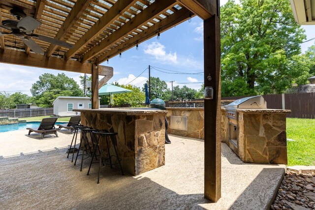 208 E Nakoma, Round Rock, TX 78664 - fenced backyard with an outdoor bar, a pergola, and a patio