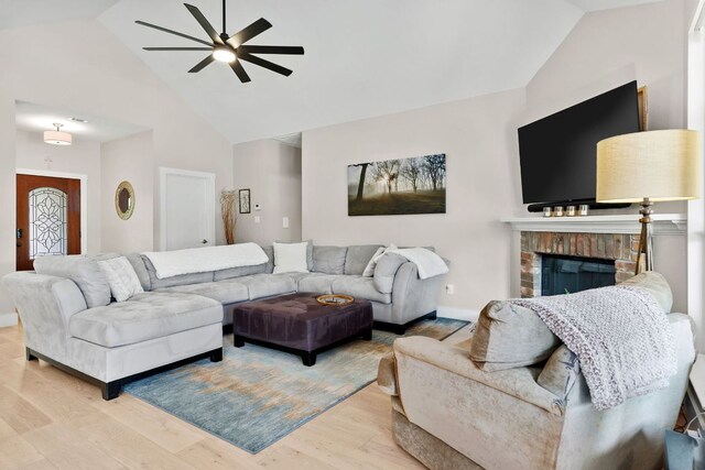 208 E Nakoma, Round Rock, TX 78664 - living area with ceiling fan, wood finished floors, baseboards, a brick fireplace, and high vaulted ceiling