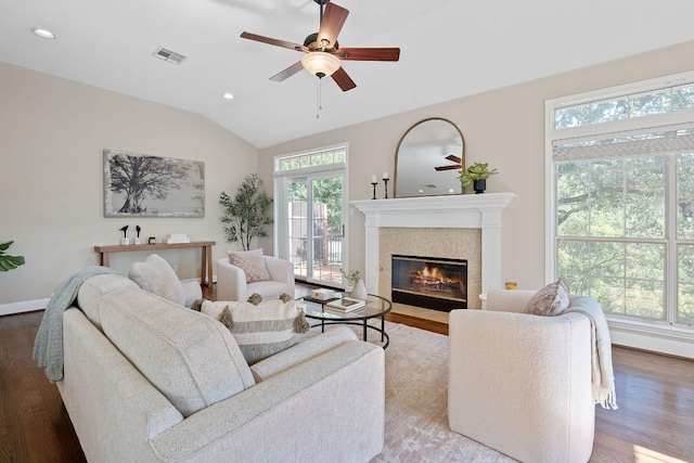 6706 Fort Davis Cv Unit B, Austin, TX 78731 - living area featuring healthy amount of natural light, wood finished floors, a ceiling fan, a high end fireplace, and lofted ceiling