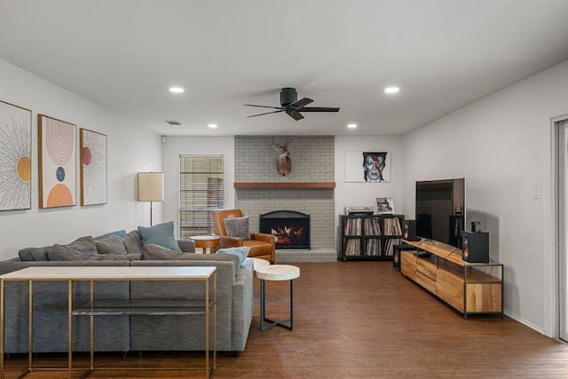 10207 Ray Ave, Austin, TX 78758 - living area with ceiling fan, dark wood-type flooring, a brick fireplace, and recessed lighting
