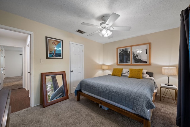 10207 Ray Ave, Austin, TX 78758 - carpeted bedroom featuring a textured ceiling, a ceiling fan, and baseboards