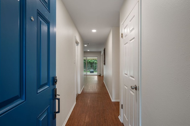 10207 Ray Ave, Austin, TX 78758 - hallway featuring dark wood-style flooring, baseboards, and recessed lighting