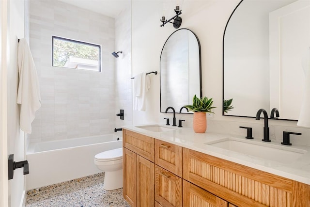 2301 Canterbury, Austin, TX 78702 - full bathroom with speckled floor, toilet, bathtub / shower combination, and double vanity
