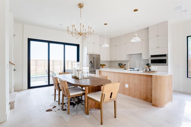 2301 Canterbury, Austin, TX 78702 - dining area featuring plenty of natural light and a chandelier