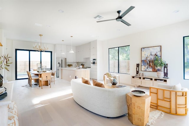 2301 Canterbury, Austin, TX 78702 - living room featuring ceiling fan and a chandelier