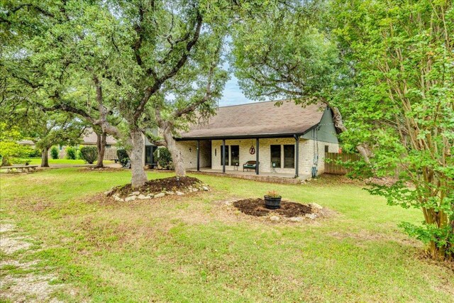 336 Primrose Dr, Kyle, TX 78640 - view of front of house featuring a patio and an outdoor fire pit