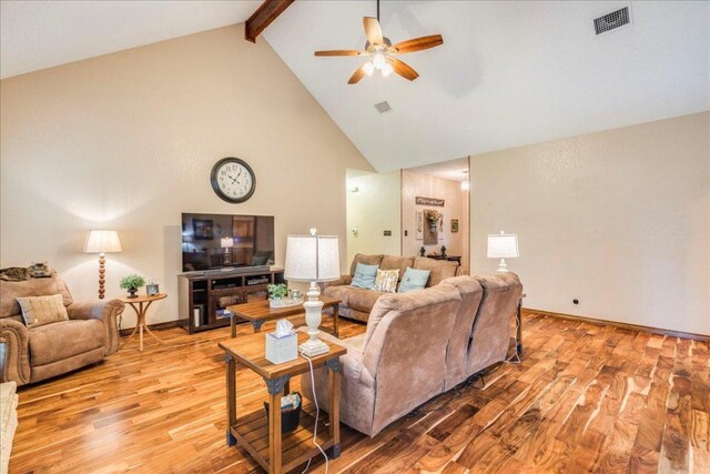 336 Primrose Dr, Kyle, TX 78640 - living room with high vaulted ceiling, a ceiling fan, beamed ceiling, light wood-style floors, and baseboards