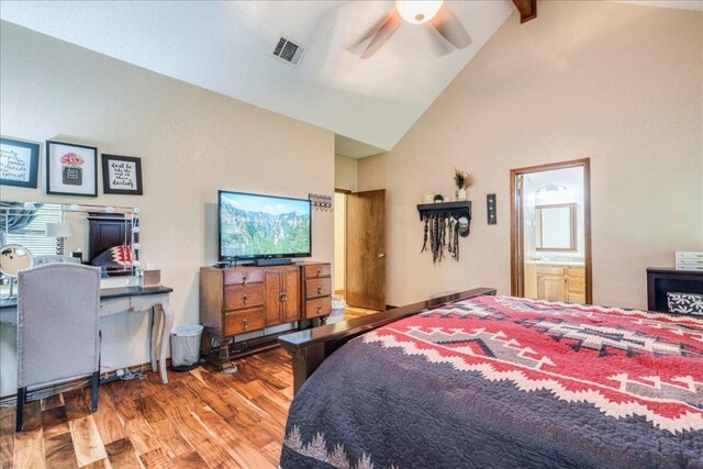 336 Primrose Dr, Kyle, TX 78640 - bedroom with wood finished floors, high vaulted ceiling, beam ceiling, a ceiling fan, and ensuite bathroom