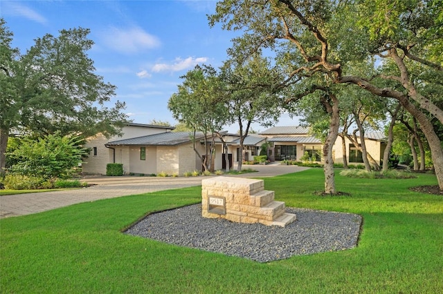 9517 Veletta Pl, Austin, TX 78735 - mid-century inspired home with a front yard and metal roof