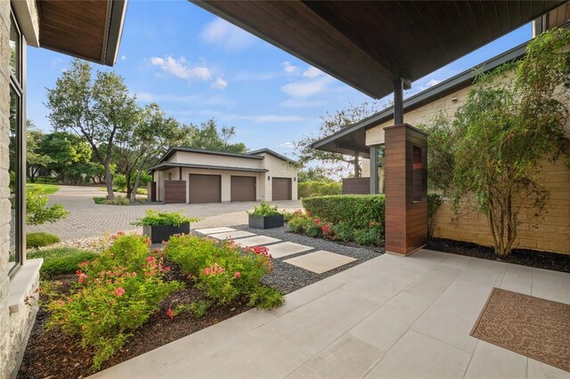 9517 Veletta Pl, Austin, TX 78735 - view of patio with an outdoor structure and a detached garage