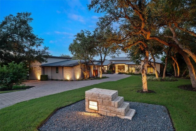 9517 Veletta Pl, Austin, TX 78735 - view of front facade featuring a front lawn, metal roof, and decorative driveway