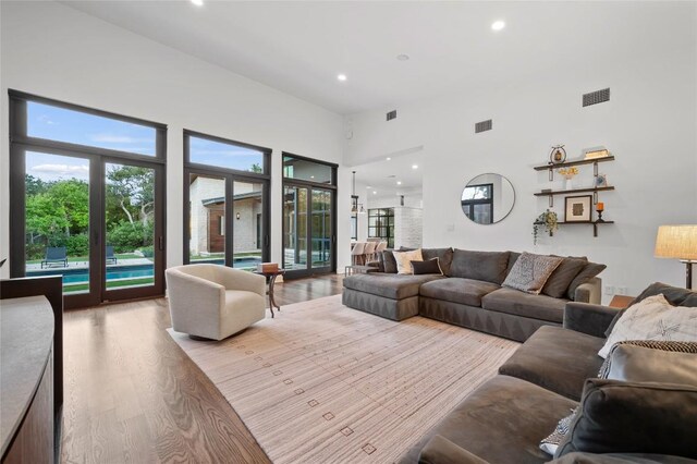 9517 Veletta Pl, Austin, TX 78735 - living area with wood finished floors, recessed lighting, and a towering ceiling