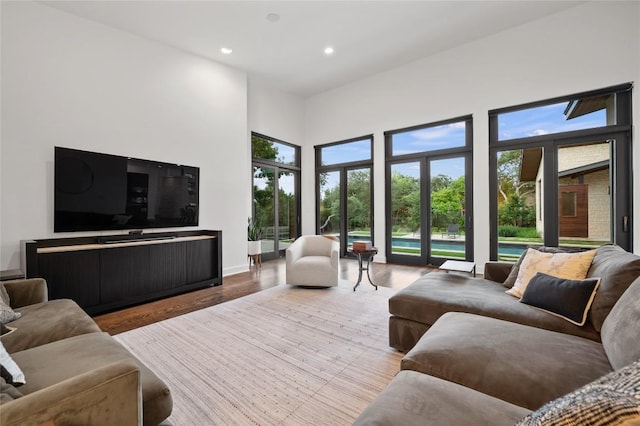 9517 Veletta Pl, Austin, TX 78735 - living area featuring a high ceiling, recessed lighting, wood finished floors, and baseboards