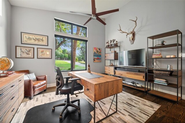 9517 Veletta Pl, Austin, TX 78735 - office area featuring a ceiling fan, wood finished floors, high vaulted ceiling, and baseboards