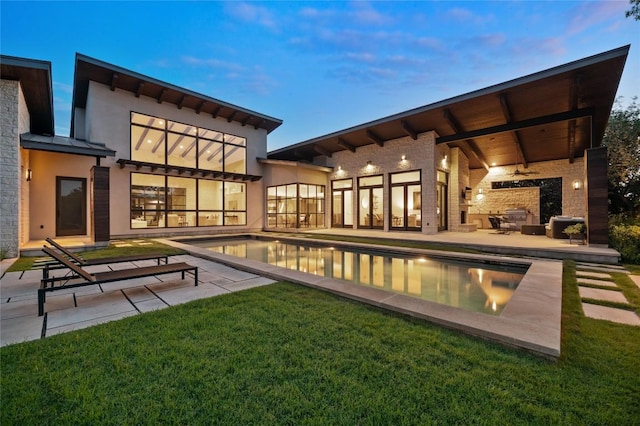 9517 Veletta Pl, Austin, TX 78735 - rear view of property with a patio, an outdoor pool, a yard, and a ceiling fan