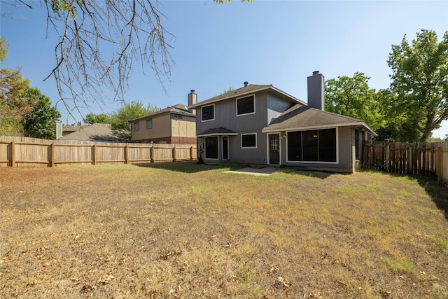 4700 Fallenash Dr, Austin, TX 78725 - rear view of house with a chimney