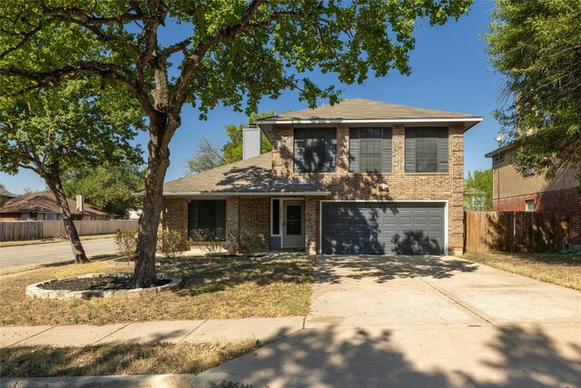 4700 Fallenash Dr, Austin, TX 78725 - traditional home featuring an attached garage, concrete driveway, and brick siding