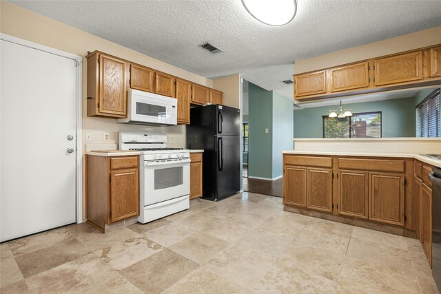 4700 Fallenash Dr, Austin, TX 78725 - kitchen featuring white appliances, a textured ceiling, light countertops, brown cabinets, and a chandelier