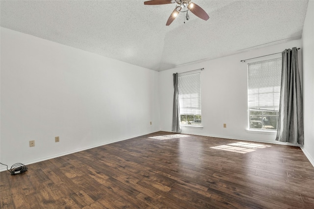 4700 Fallenash Dr, Austin, TX 78725 - empty room with a textured ceiling, wood finished floors, a ceiling fan, and baseboards