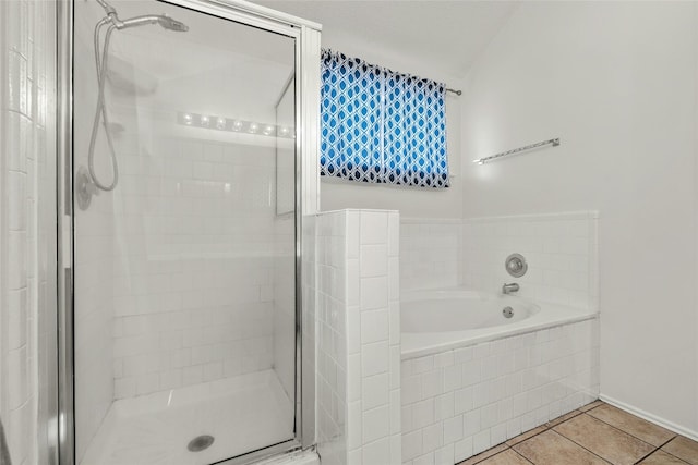 4700 Fallenash Dr, Austin, TX 78725 - bathroom featuring a shower stall, tile patterned flooring, a garden tub, and baseboards