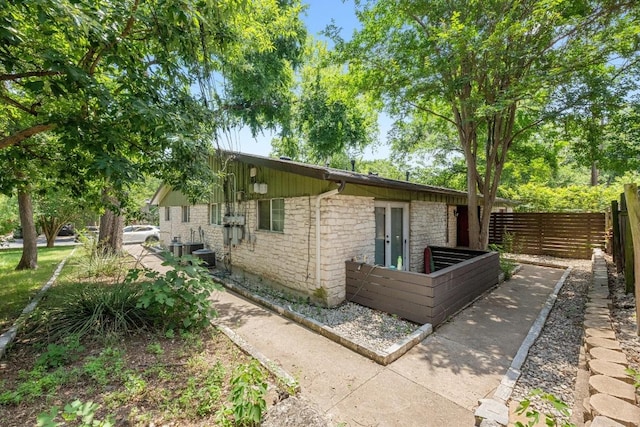 3102 Glen Ora St Unit 102, Austin, TX 78704 - view of home's exterior with stone siding