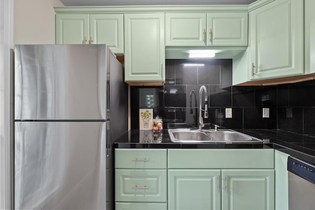 3102 Glen Ora St Unit 102, Austin, TX 78704 - kitchen featuring stainless steel appliances, dark countertops, and decorative backsplash