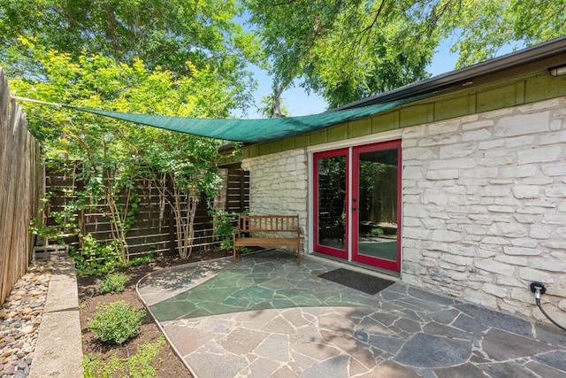 3102 Glen Ora St Unit 102, Austin, TX 78704 - entrance to property with stone siding and a patio area