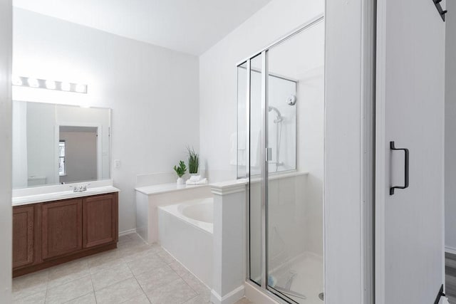 1310 Rainbow Parke Dr, Round Rock, TX 78665 - full bath featuring a garden tub, a shower stall, vanity, and tile patterned floors