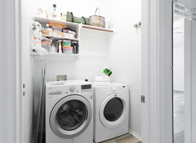 1310 Rainbow Parke Dr, Round Rock, TX 78665 - laundry area with washer and dryer, wood finished floors, and baseboards