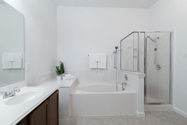 1310 Rainbow Parke Dr, Round Rock, TX 78665 - full bath featuring a garden tub, vanity, a stall shower, and tile patterned floors