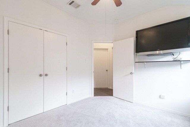 1310 Rainbow Parke Dr, Round Rock, TX 78665 - unfurnished bedroom featuring carpet flooring, a closet, and a ceiling fan