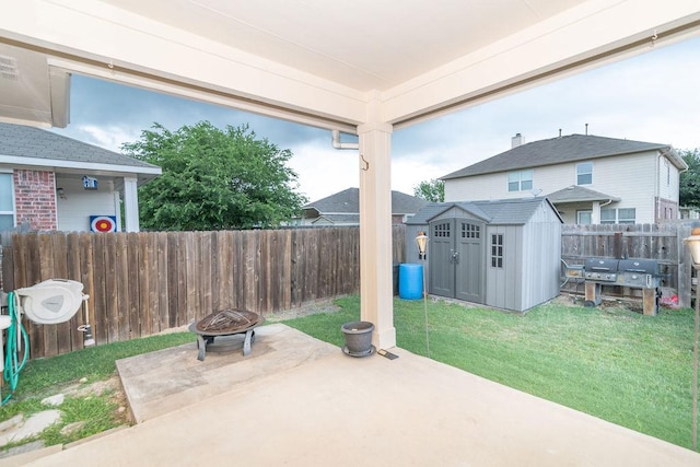 1310 Rainbow Parke Dr, Round Rock, TX 78665 - fenced backyard featuring a patio area, a storage shed, a fire pit, and grilling area