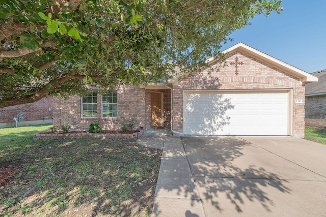 1310 Rainbow Parke Dr, Round Rock, TX 78665 - view of front of home featuring brick siding, concrete driveway, and a garage