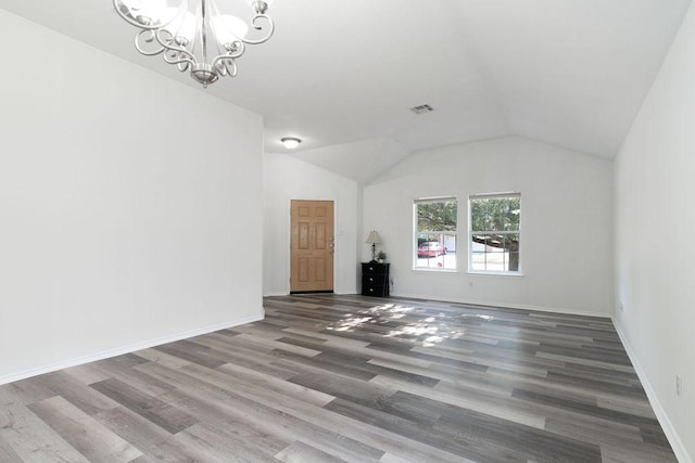 1310 Rainbow Parke Dr, Round Rock, TX 78665 - unfurnished living room featuring a chandelier, wood finished floors, lofted ceiling, and baseboards