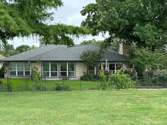 145 Turkey Run, Meadowlakes, TX 78654 - view of front of property featuring a chimney and roof with shingles