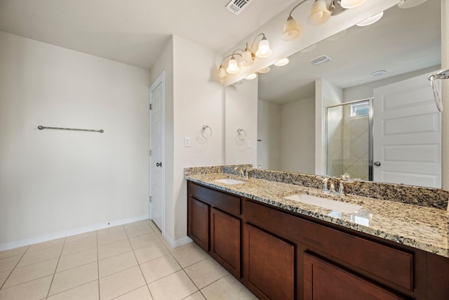 5406 Traviston Dr, Austin, TX 78738 - bathroom featuring double vanity, a shower stall, tile patterned flooring, and baseboards